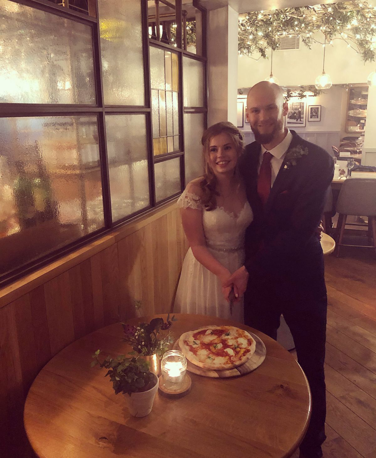 Cutting the Pizza, a quirky Idea from our bride and groom.