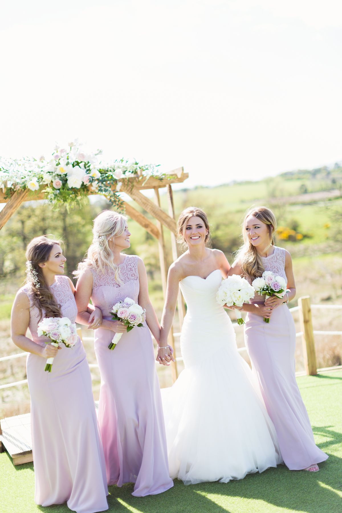 Bethany and her Bridesmaids sharing a moment