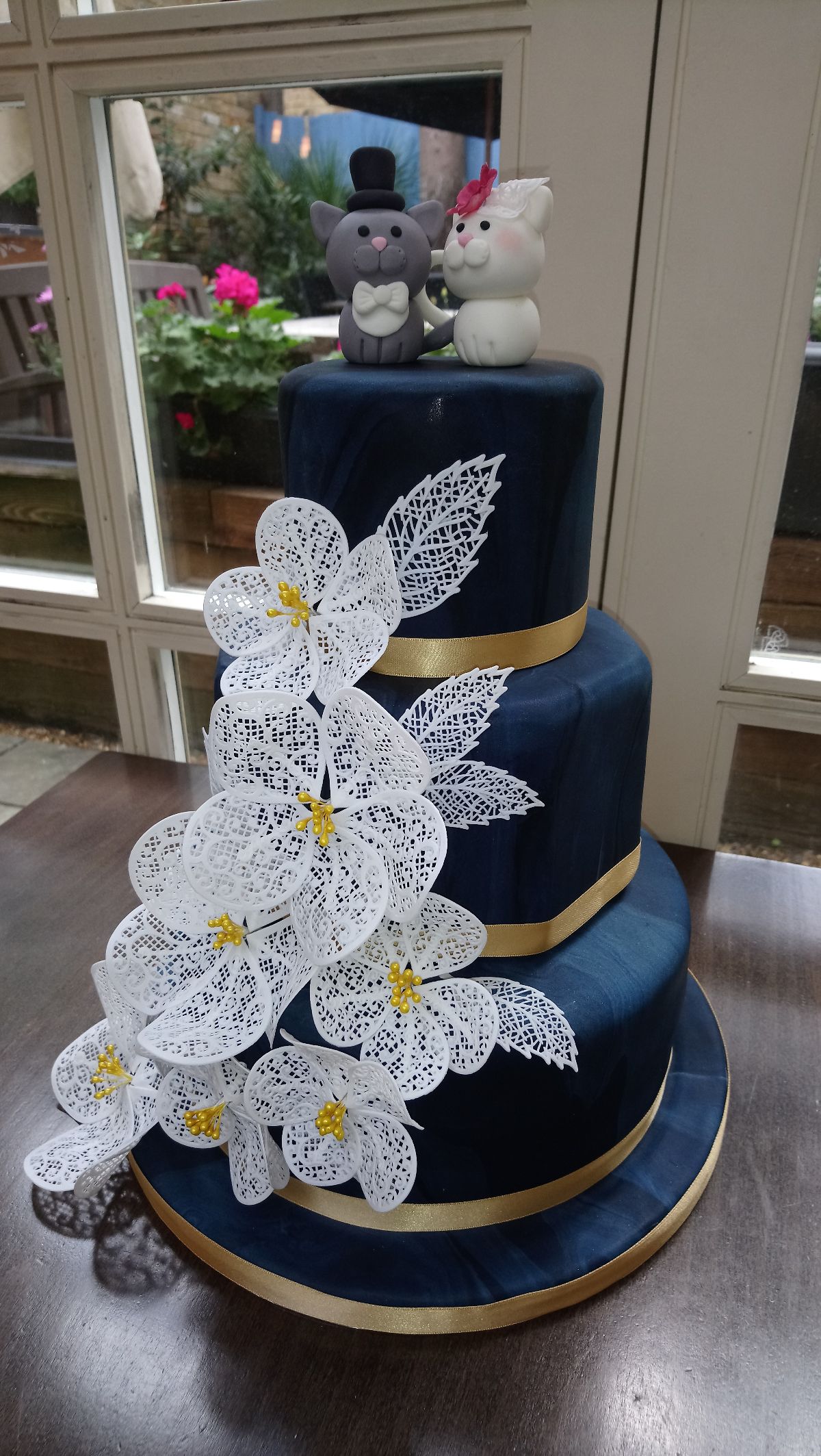 Navy Marbled Octagonal and Round Tiers with Cake Lace Flowers and Handmade Bride and Groom Cat Topper