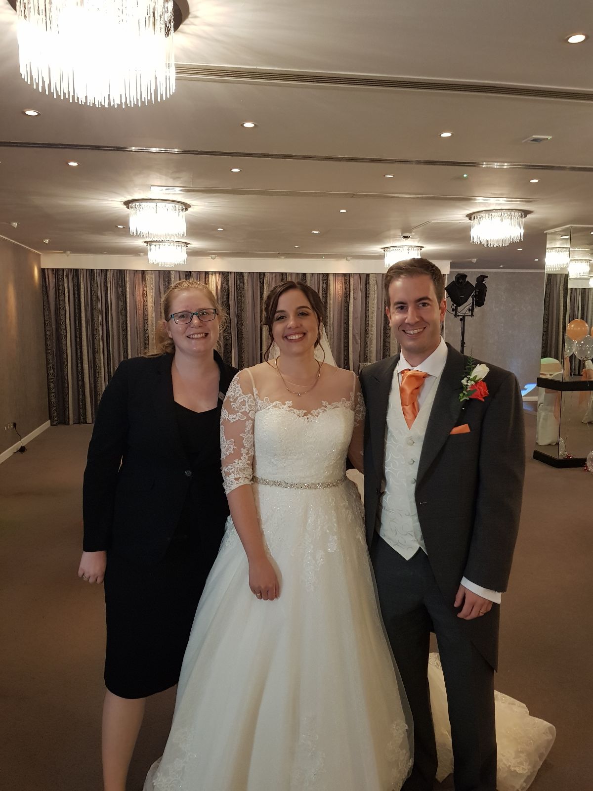 The happy couple with the wedding co-ordinator Sam.
