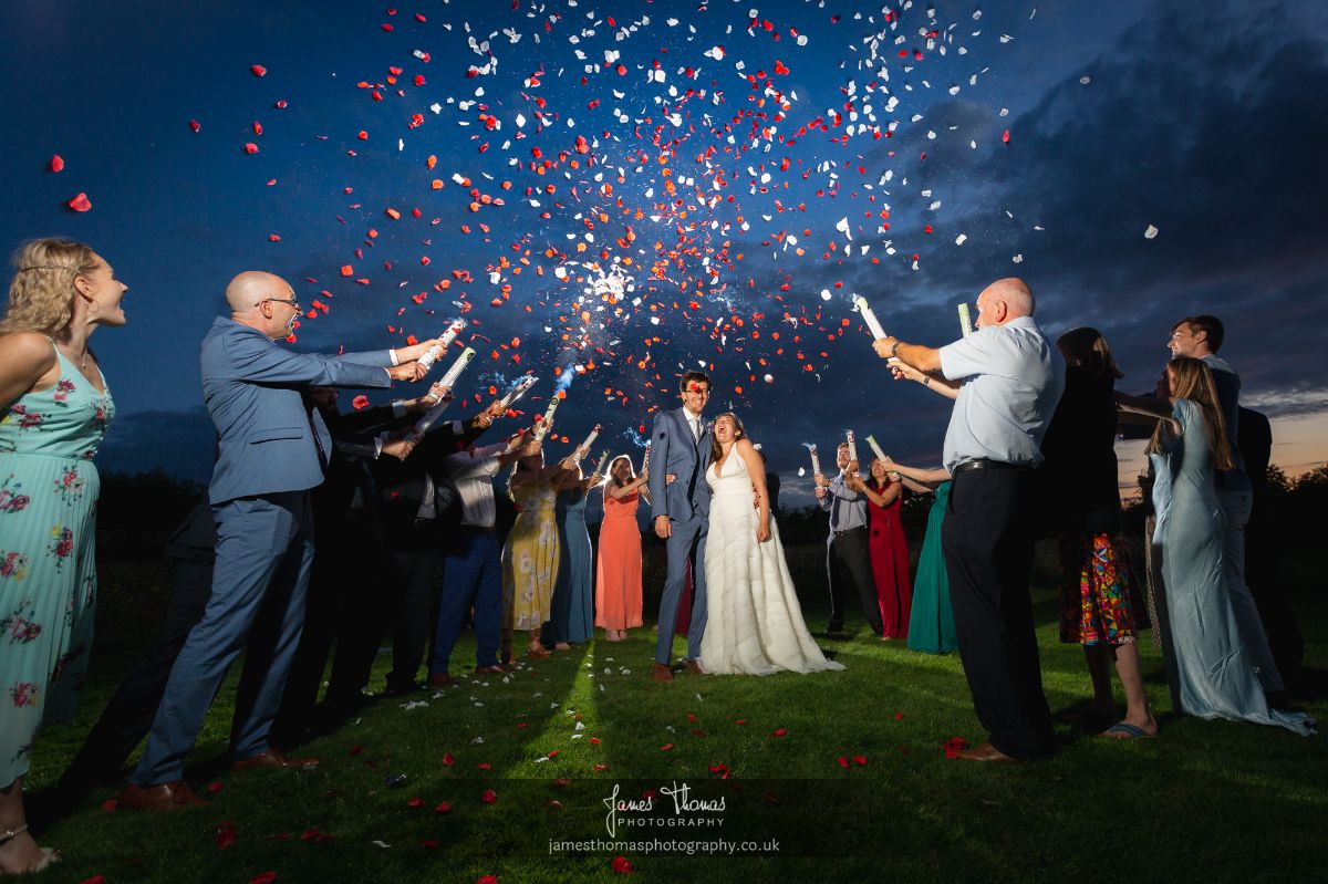 Confetti cannons let of at night with some carefully placed off camera flash.