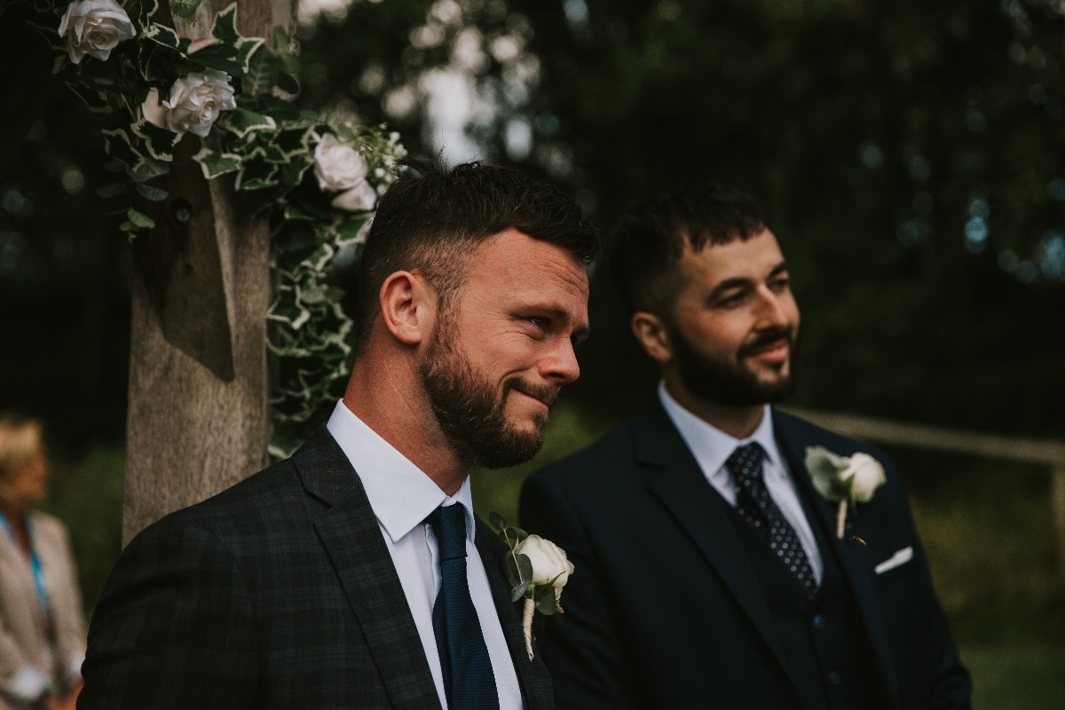 emotional first look as the bride walks down the isle