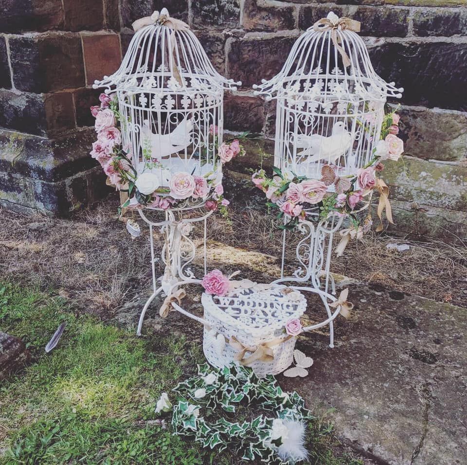 Two of the largerbirdcages.  I also have two smaller birdcages the same.  Also heart shaped basket with flowers and ribbons to match the theme, berlap and hessian which looked amazing.