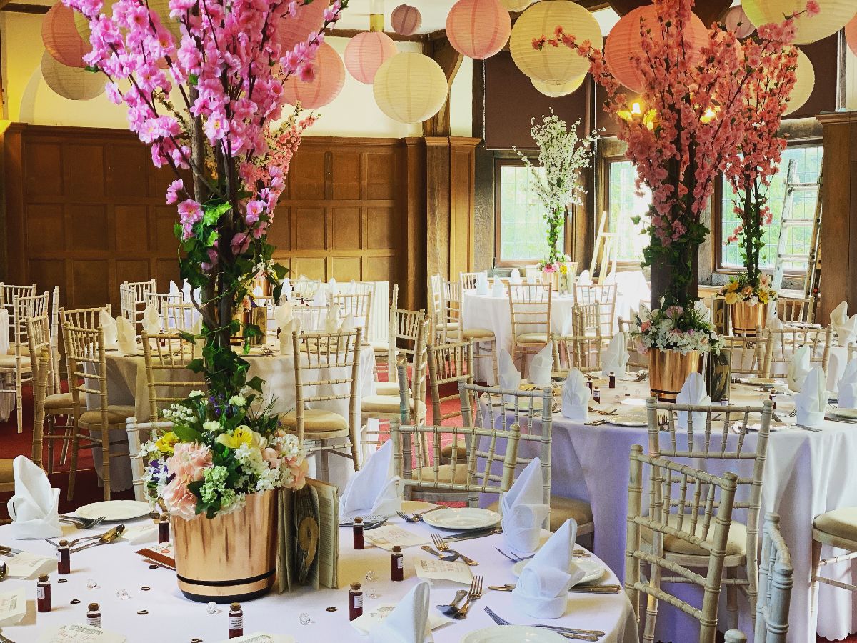 A bright layout for the wedding breakfast inside the Irfon Suite