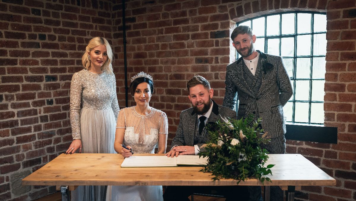 Signing the register. 