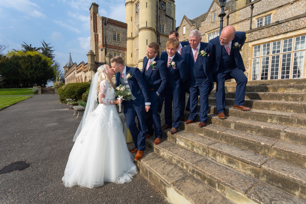 Grooms men and a kiss