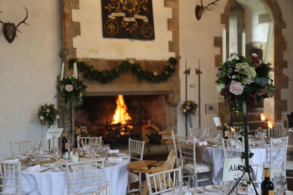 Floral arrangement on fire surround in Great Chamber