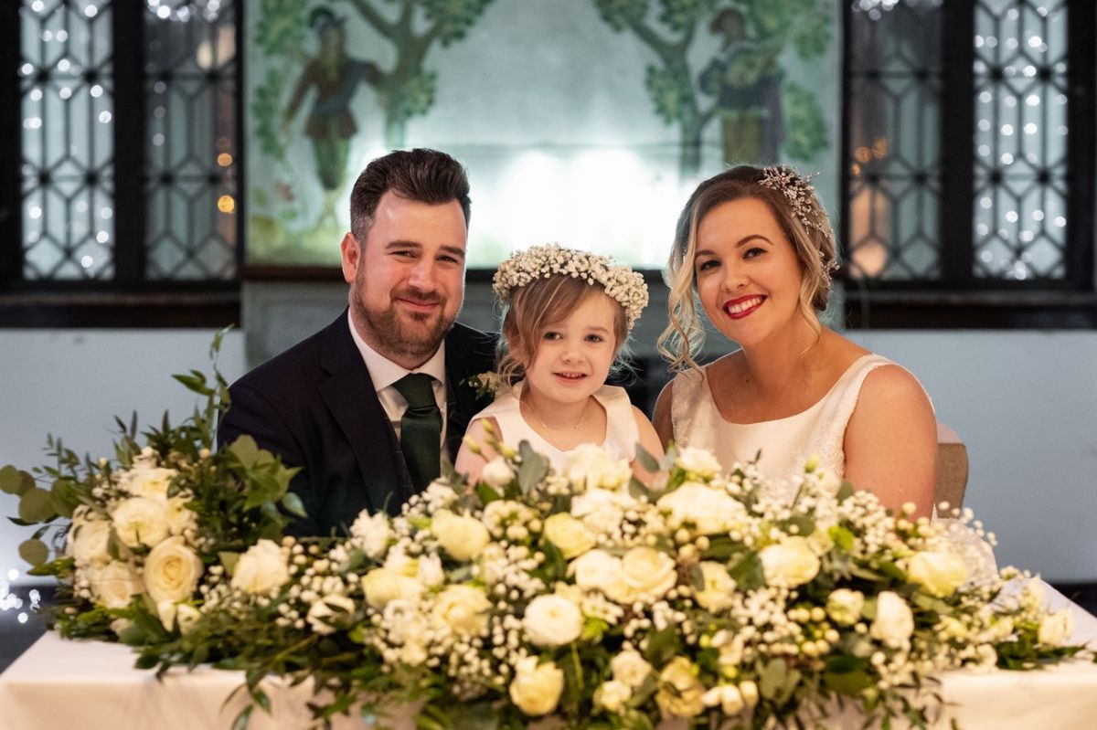 Laura, Steve and their daughter on their wedding day.