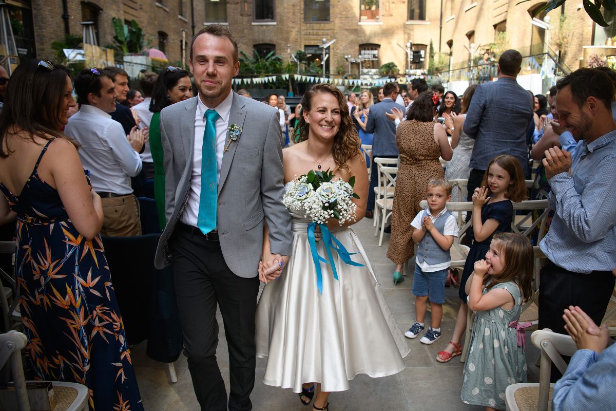 Sam and Samantha walking back down the aisle to Uptown Funk by Mark Ronson. If you look very closely you can see the string quartet up on the balcony on the right hand side. A string quartet can still be heard really well, even from this distance!