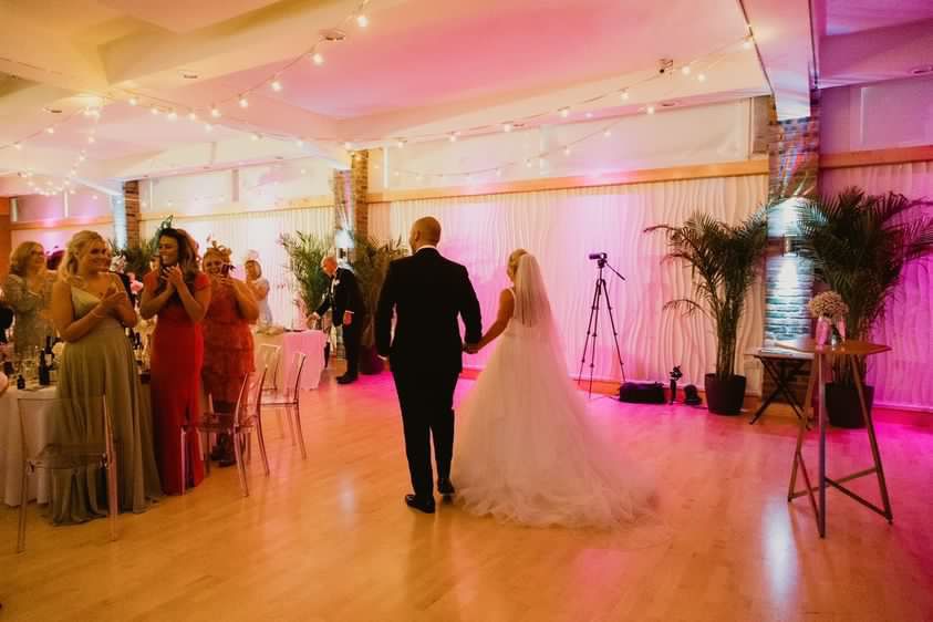 The Bride and Groom entering their reception