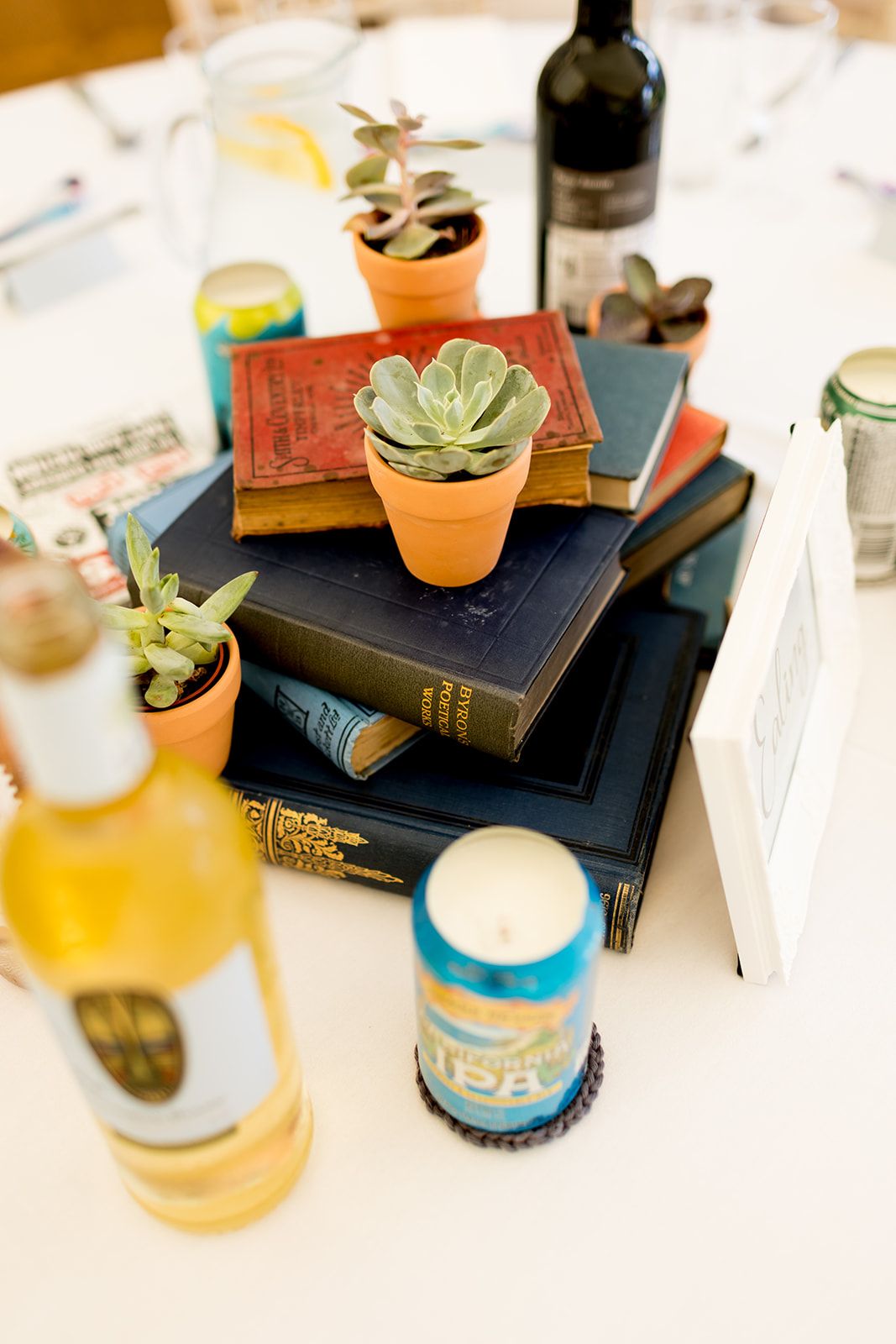 Amazing table centres arranged by the bride from vintage books and succulent plants