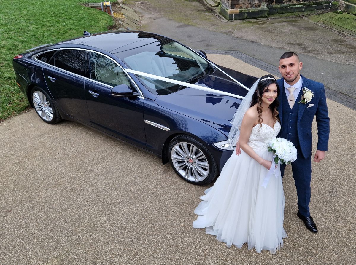 Leicester Wedding Cars managed to get a different picture of the happy couple on their wedding day with the Jaguar XJ transport.