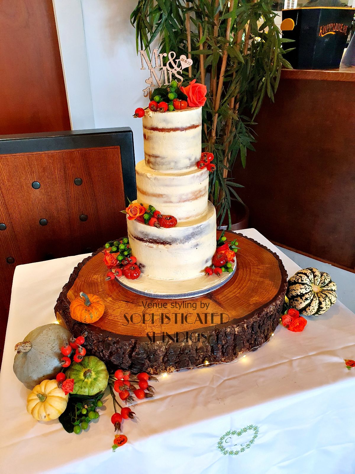 Our large, rustic tree slice to display the cake in style.