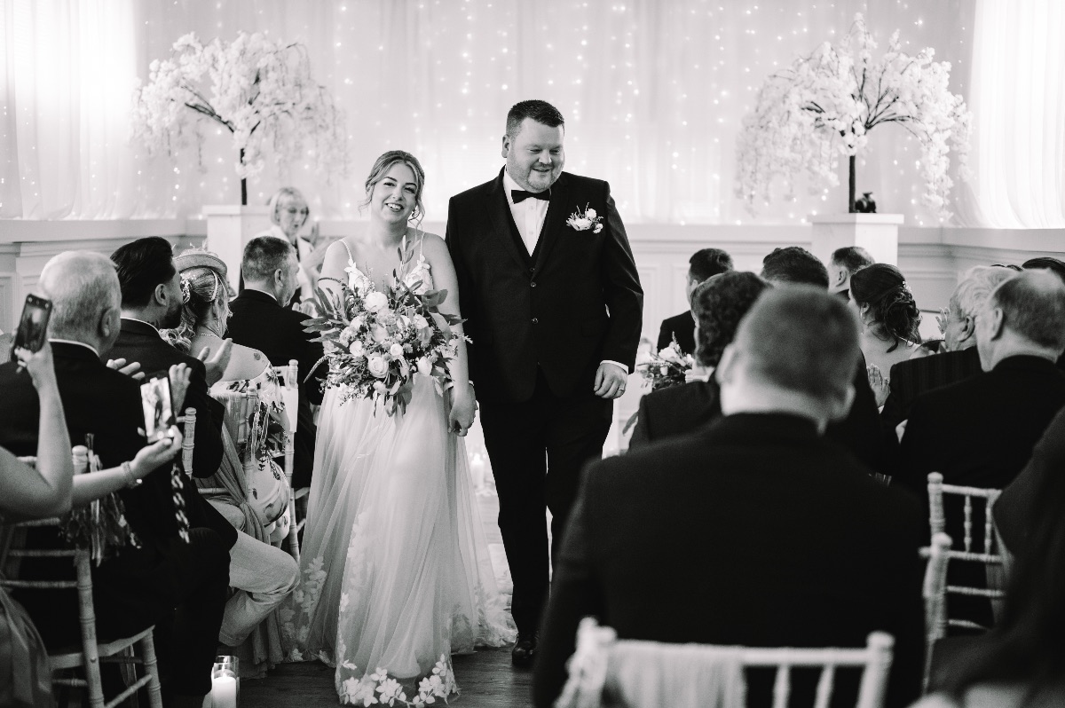 Sam & Cara just married as they leave the ceremony room at Carr Bank Wedding Venue Mansfield Nottinghamshire