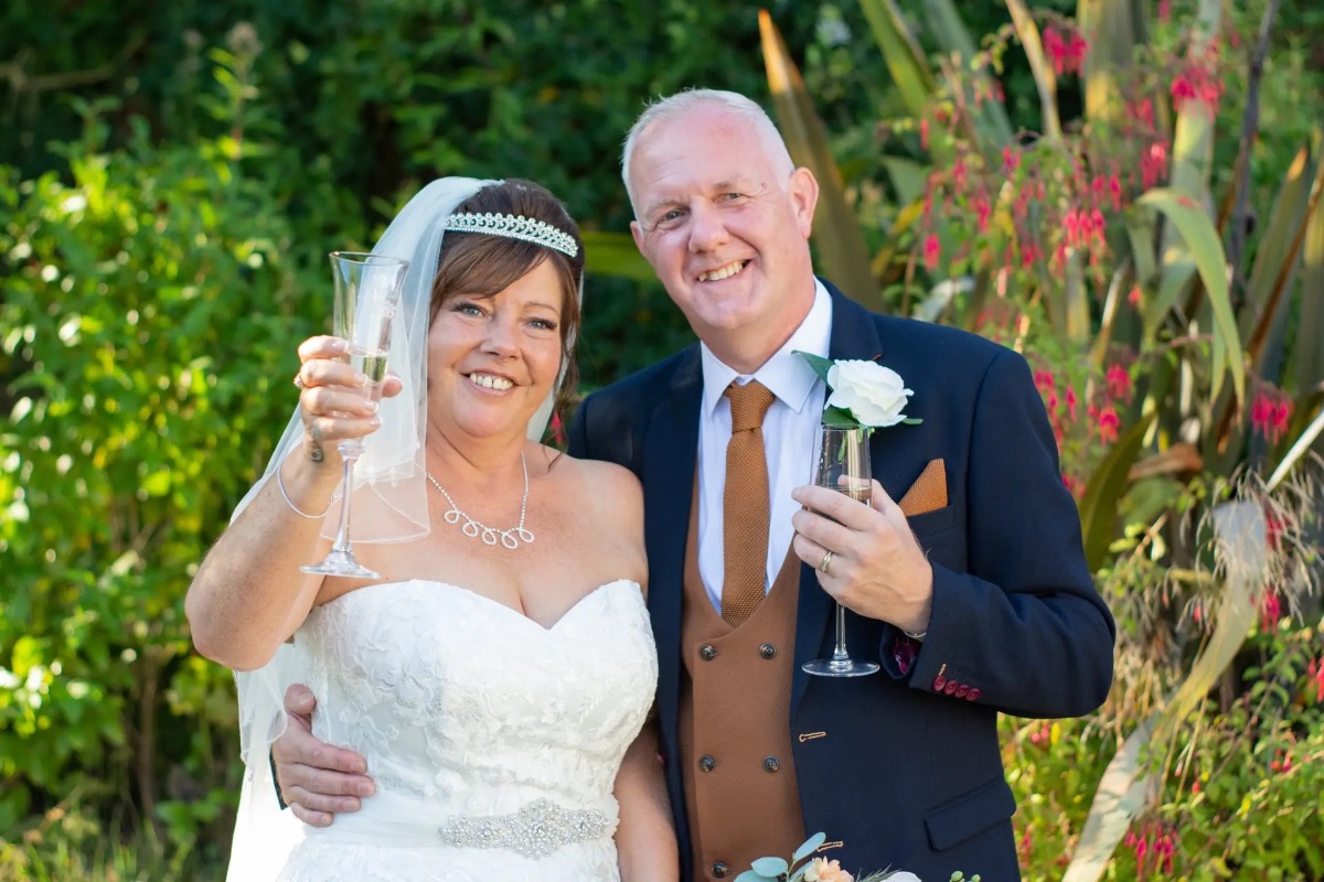 Nicola & mark enjoying some fizz in the Carr Bank grounds at Carr Bank Wedding Venue Mansfield Nottinghamshire 