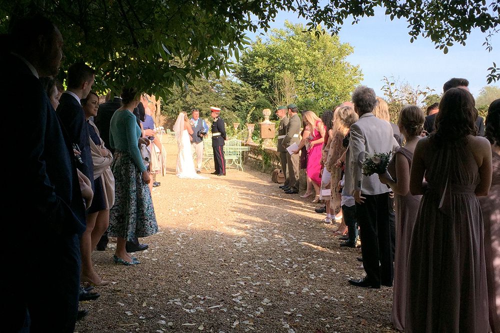 The bride and groom joined their guests outside in the garden after the ceremony.