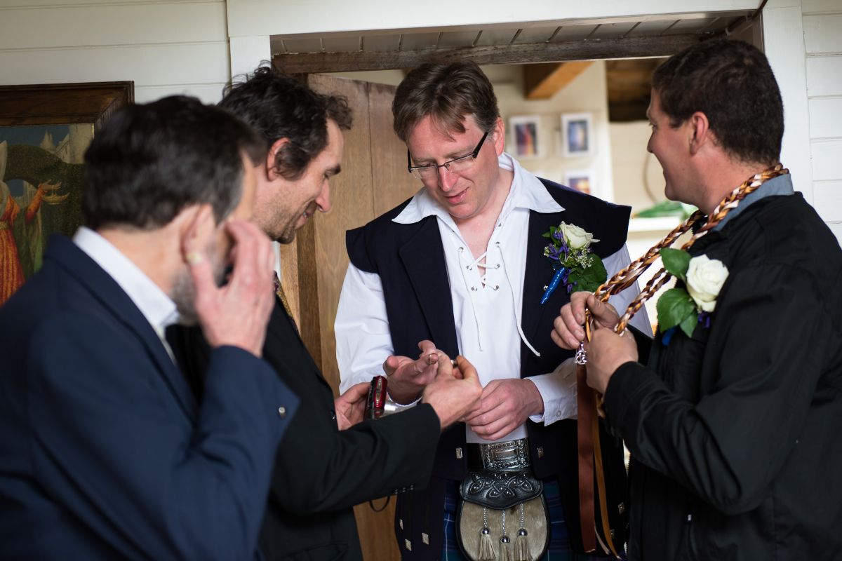 Grooms almost always appreciate a hand with cuffs, kilts and button-holes...
