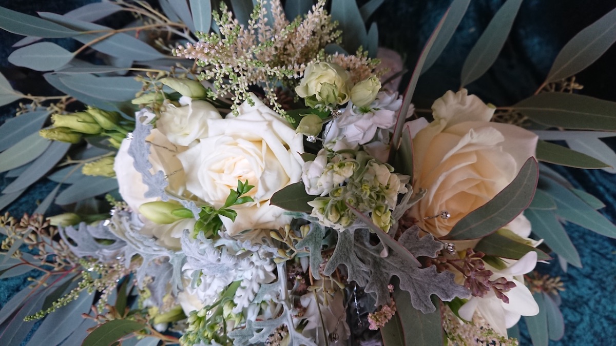 Bride bouquet with roses, stocks, eustoma, garden roses and freesia