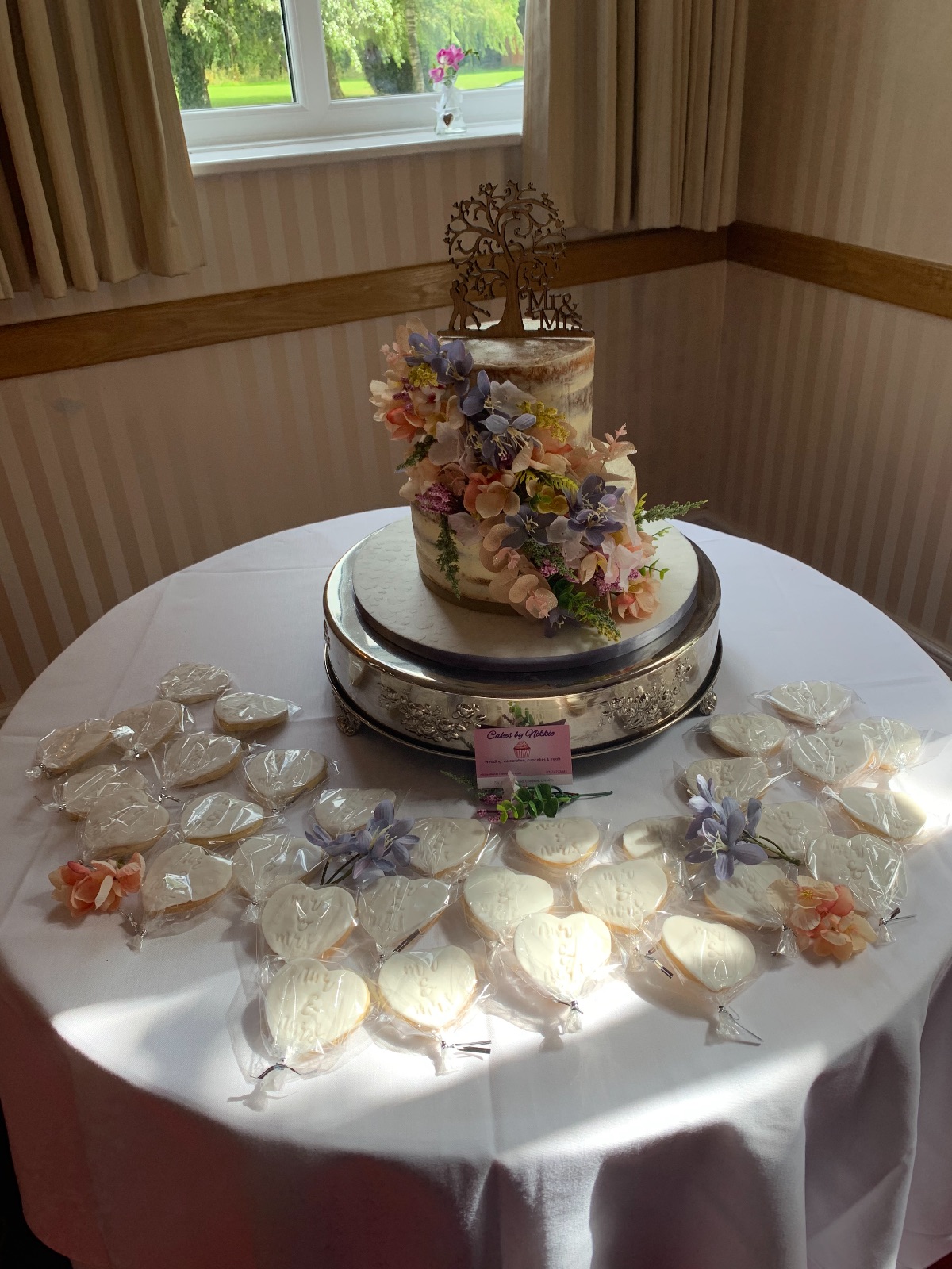 Semi naked cake in two flavours, complete with the complimentary heart shaped shortbread.