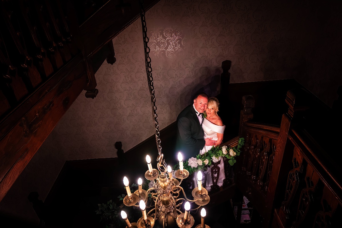 The oak stairs at Fanhams Hall make for very romantic photos