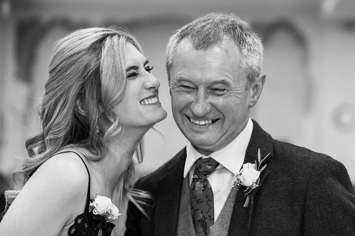 The best woman gives her dad a little kiss of encouragement and good luck.