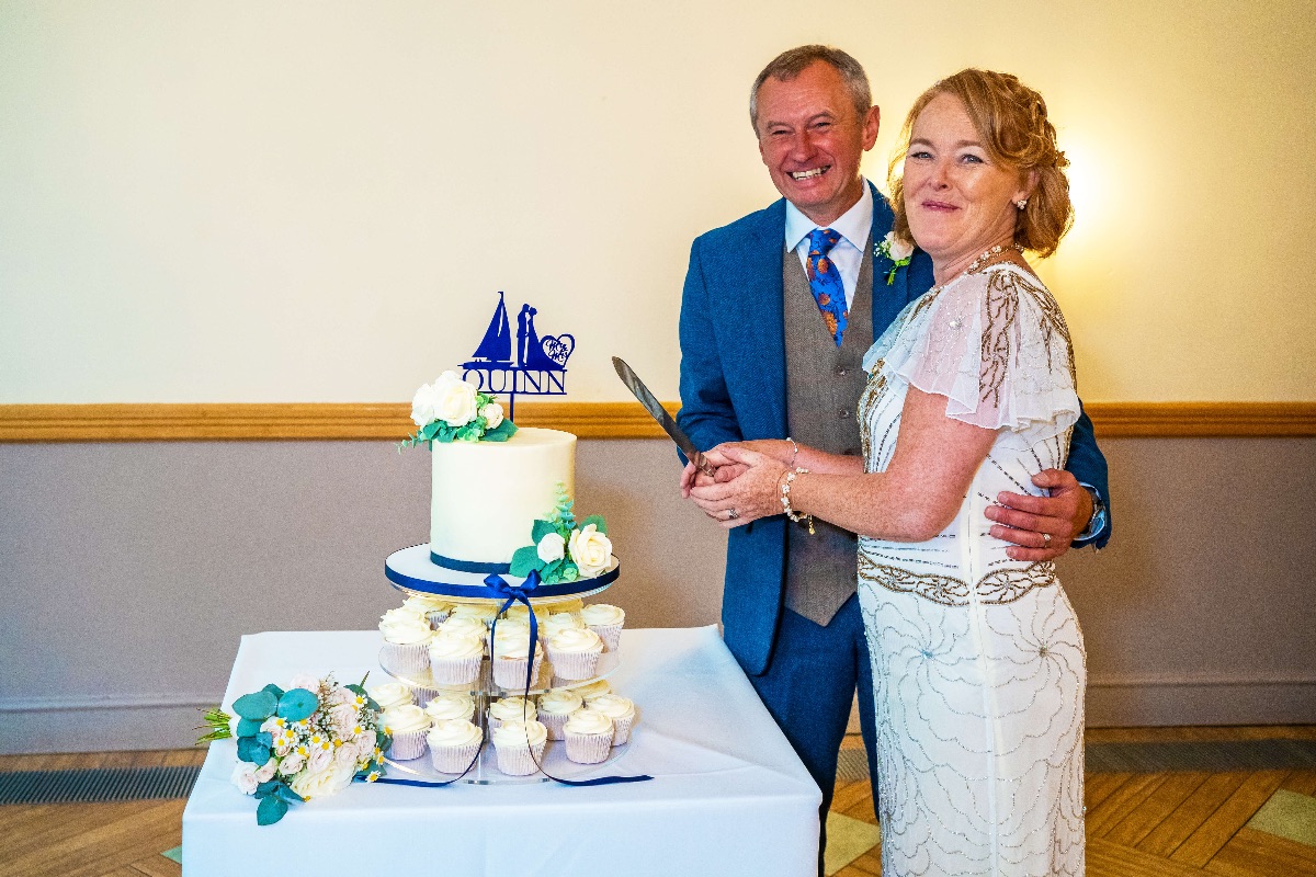 Time to cut the cake.  The groom, a sailor had a boat on top of the cake