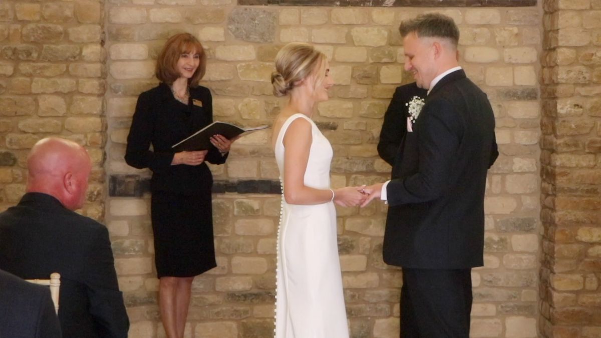 Kim and Tom exchange vows