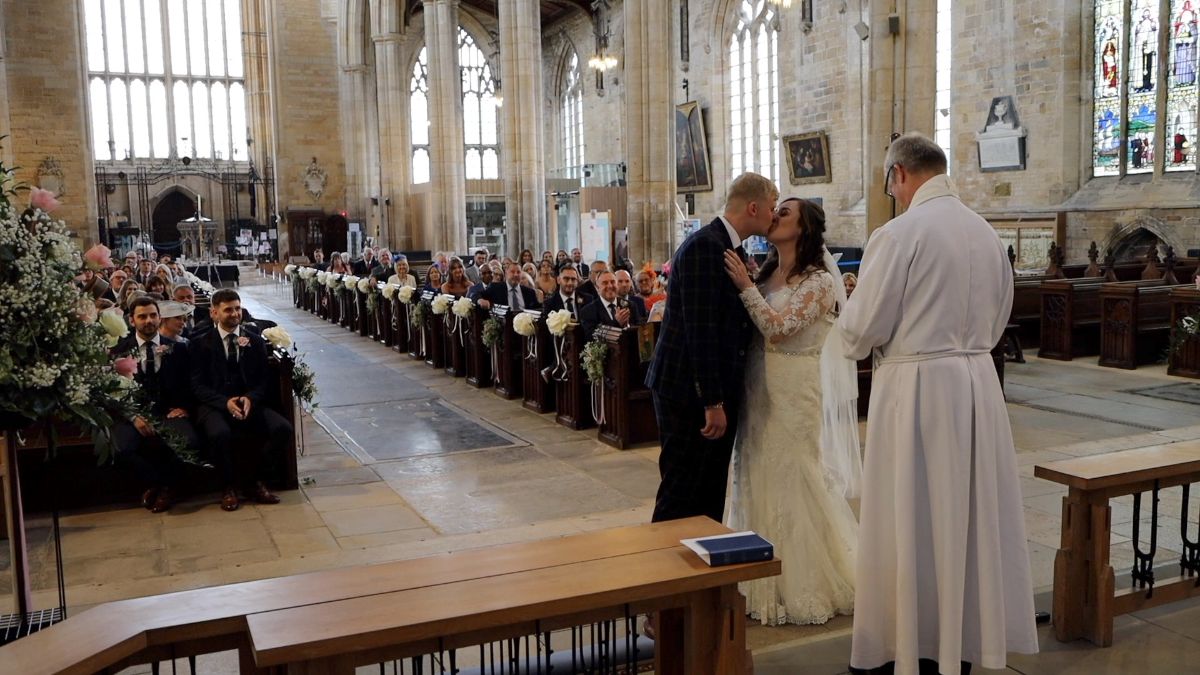 Mr and Mrs Rose share their first married kiss in the stunning Boston Stump