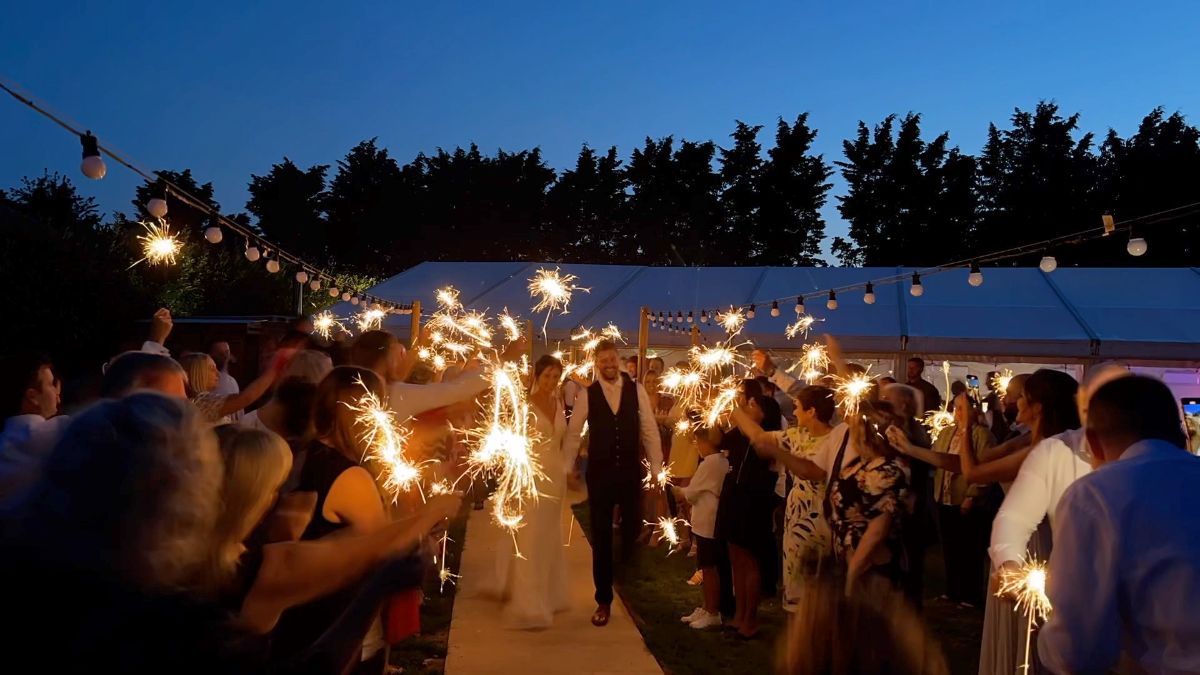 A sparkling guard of honour for the bride and groom