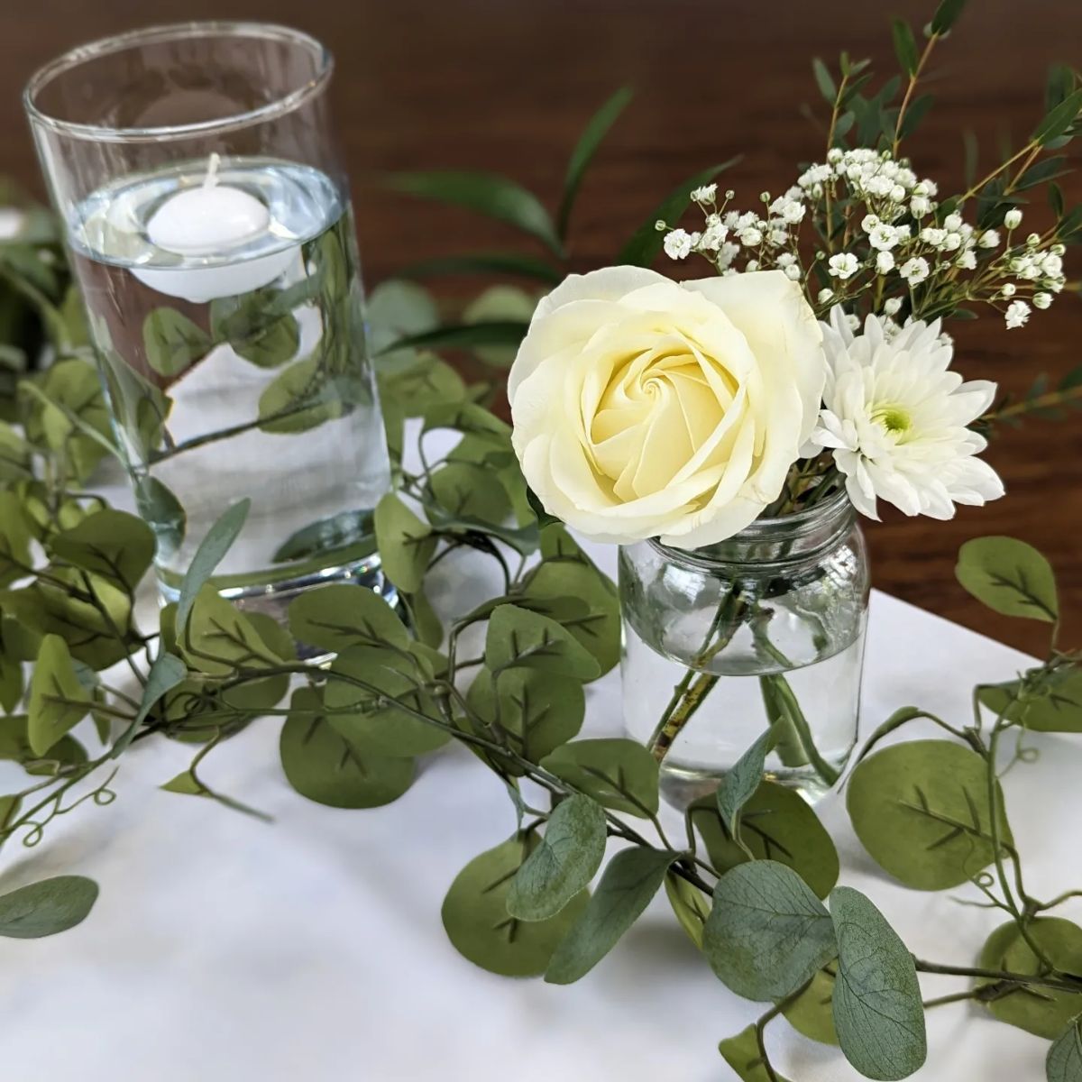 White Florals with glass decor and greenery