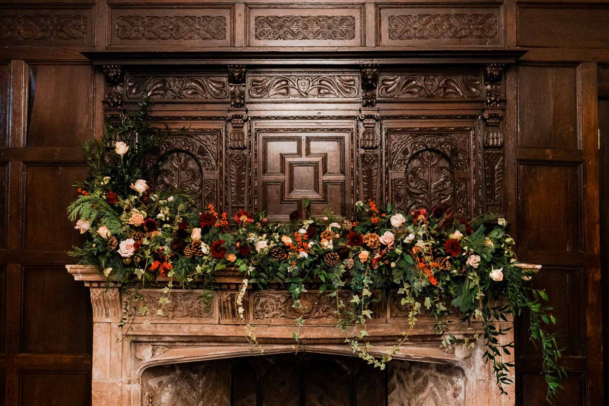 Beautiful Winter mantle piece flowers in the Bishop of Bayeux Ceremony room  