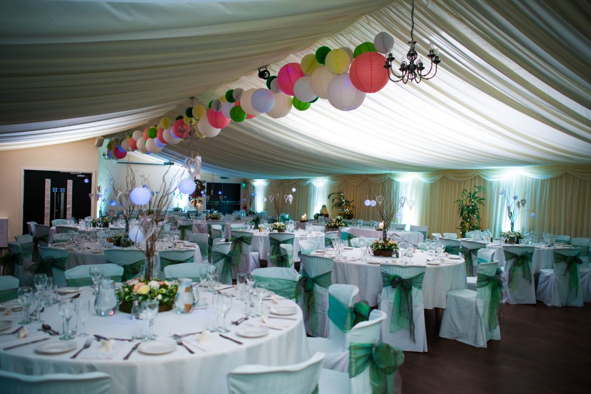 The Marquee set up for their reception, with green and woodland themes. 