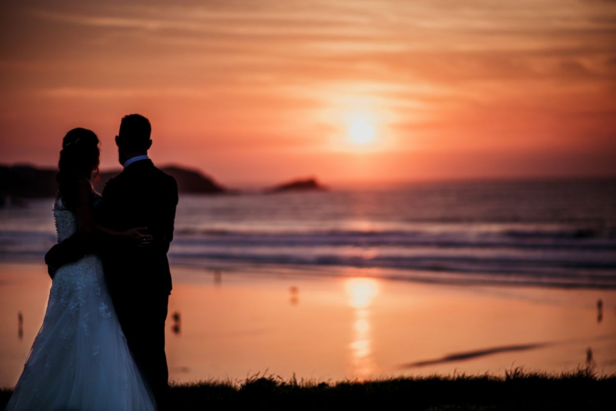 Laura & Chris with Fistral Beach in the background