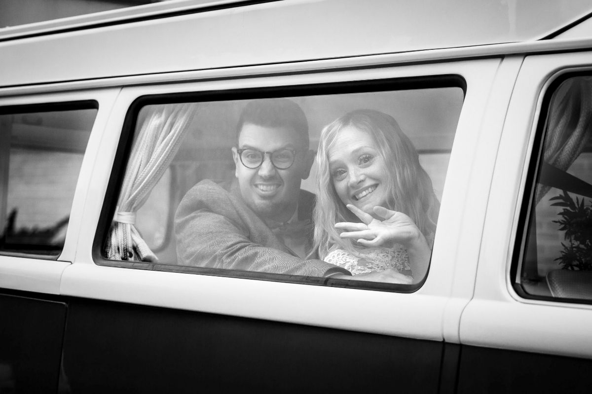 Bride & Groom in their Vintage VW Camper Van after their Market Harborough wedding