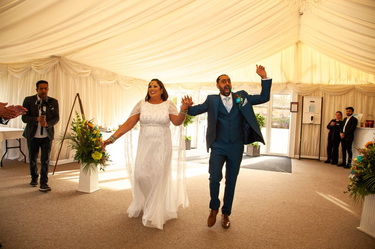 The bride and groom made dynamic entrance.