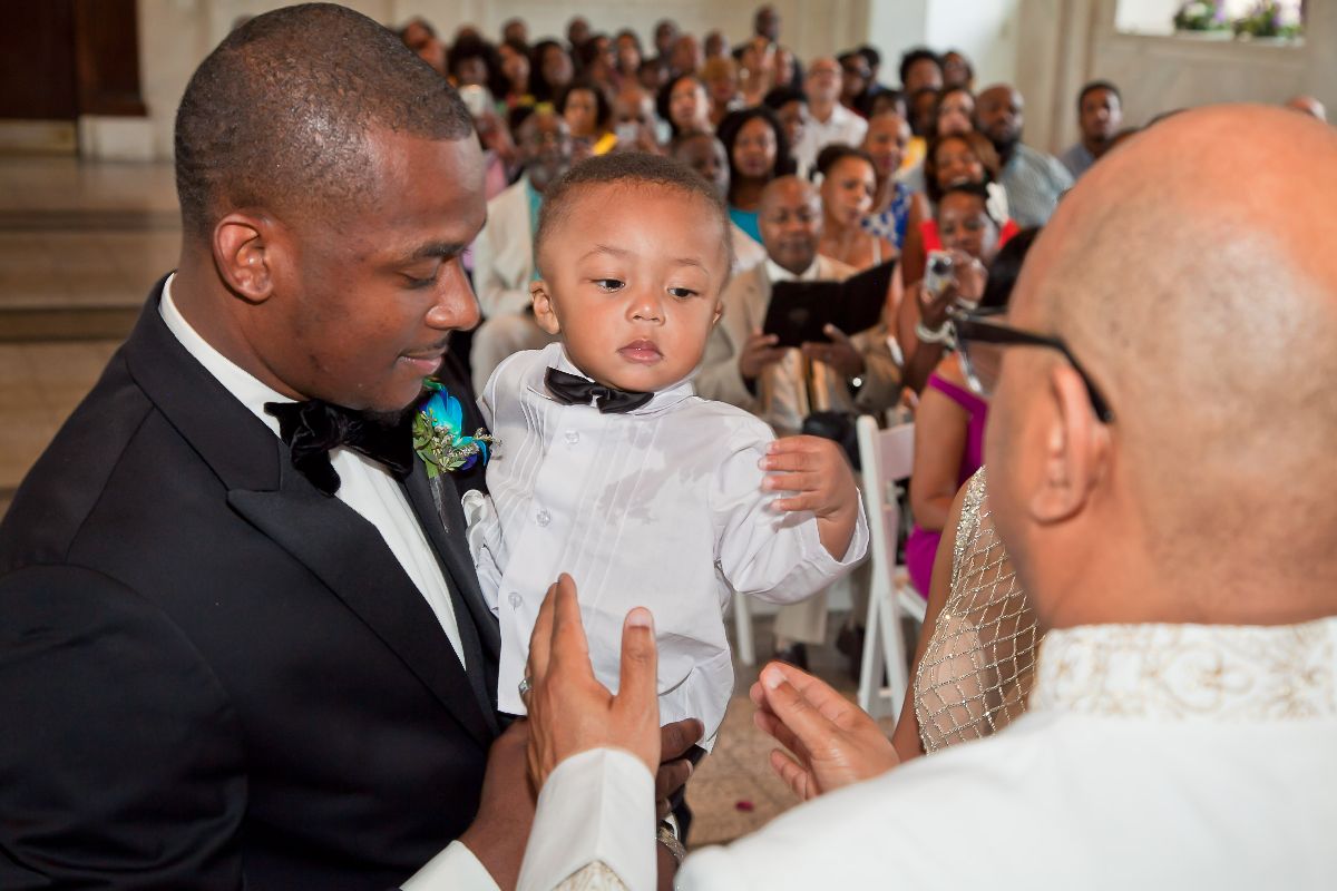 An important moment. Blessing the child at the wedding.