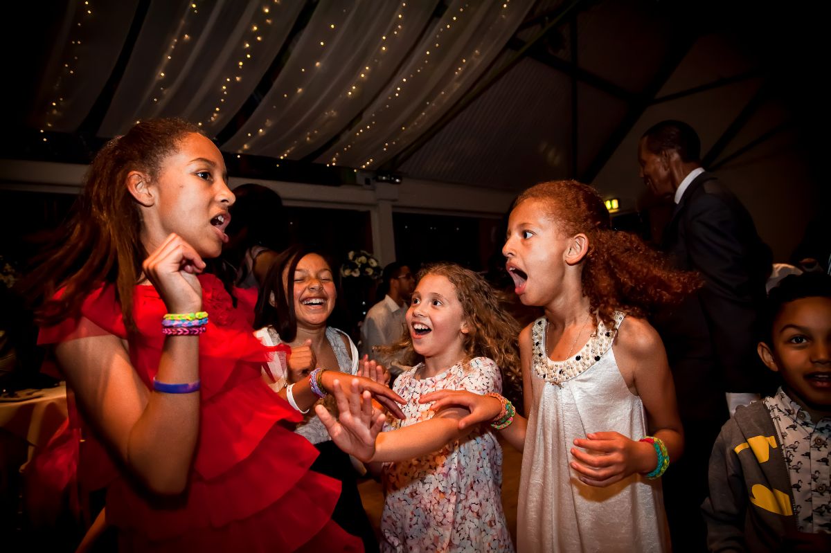 These young wedding guests are having fun. 