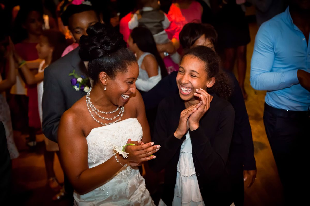 A private moment between the bride and a young female guest. 