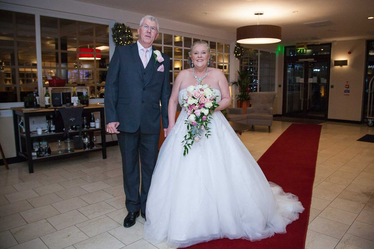 The Bride arrived with her father. 