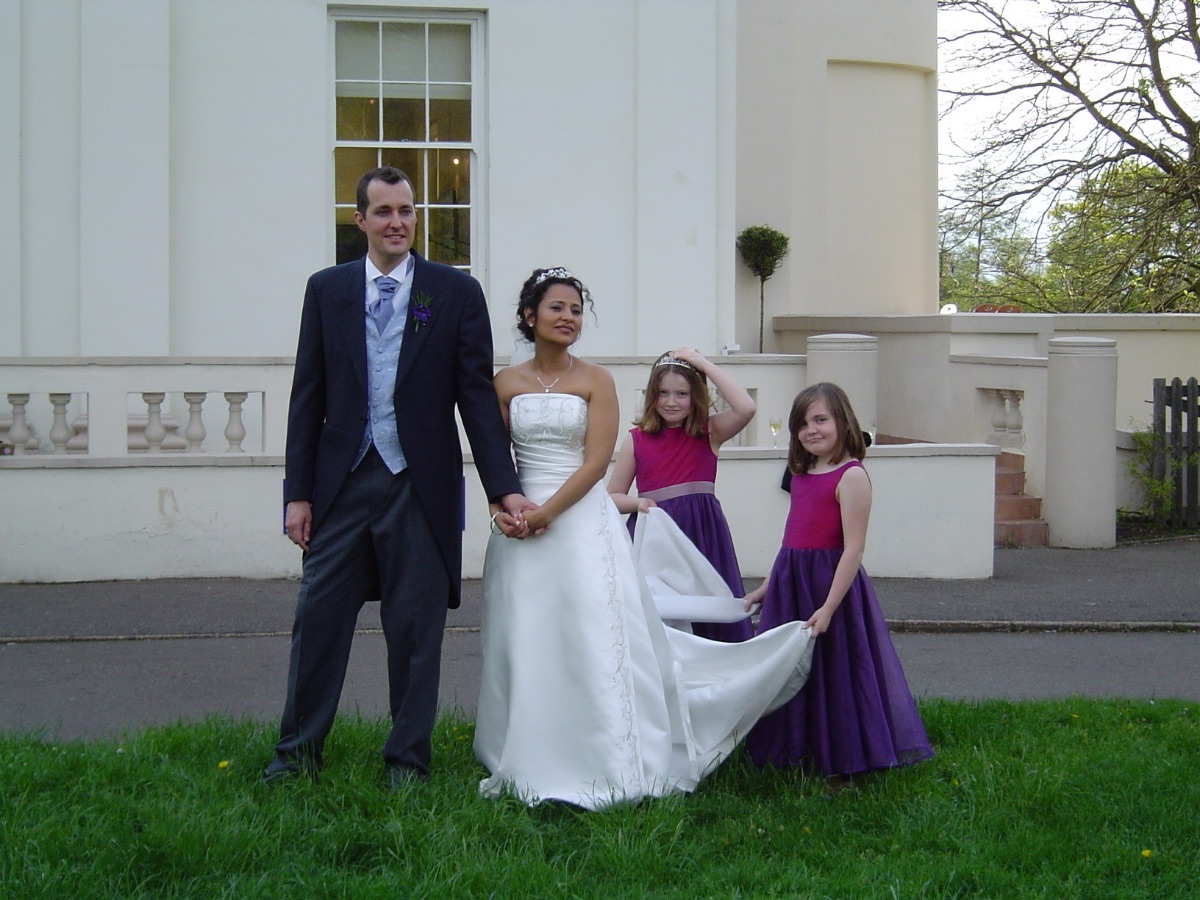 A quiet moment with their two bridesmaids 