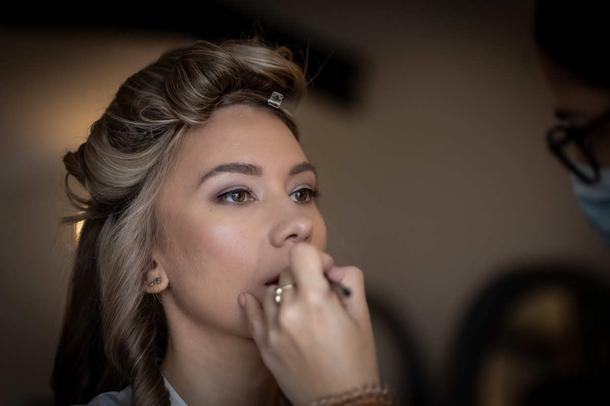 Elysia having the final touches to her makeup