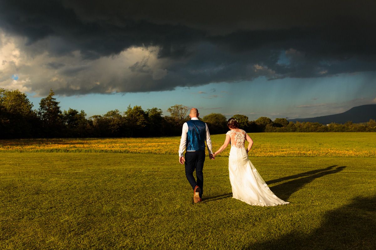 Moody skies and awesome light made this one of the most stunning photos from the day. Amy & Adam just taking time out from the celebrations for 10 minutes quiet time.