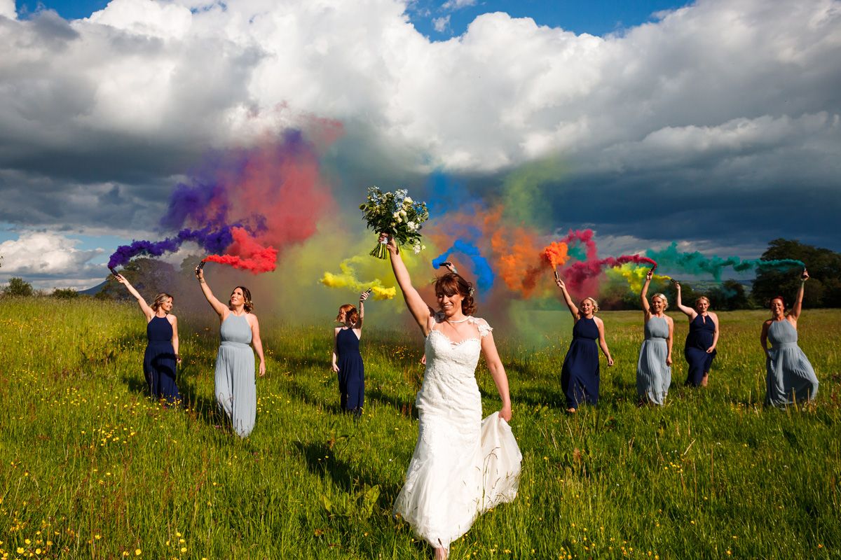 Colourful smoke grenades can add fun and drama to a wedding.