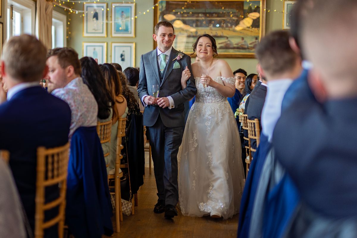 "Hand in hand, hearts aglow, stepping into a lifetime of love and celebration 🎉💕 #MrAndMrs #WeddingReception"