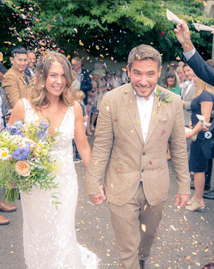 'guests cheered and covered the bride and groom in confetti'