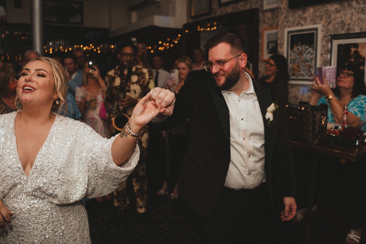 Bride and groom having fun during their first dance