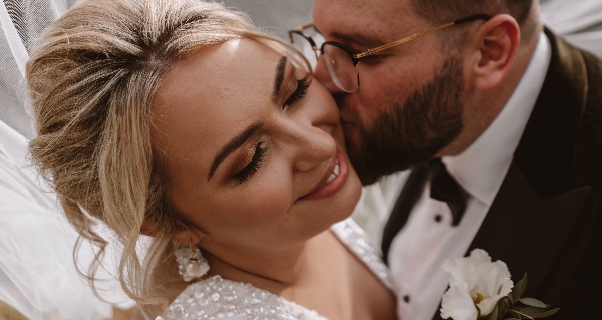 Bride and Groom kissing during their portrait photo session