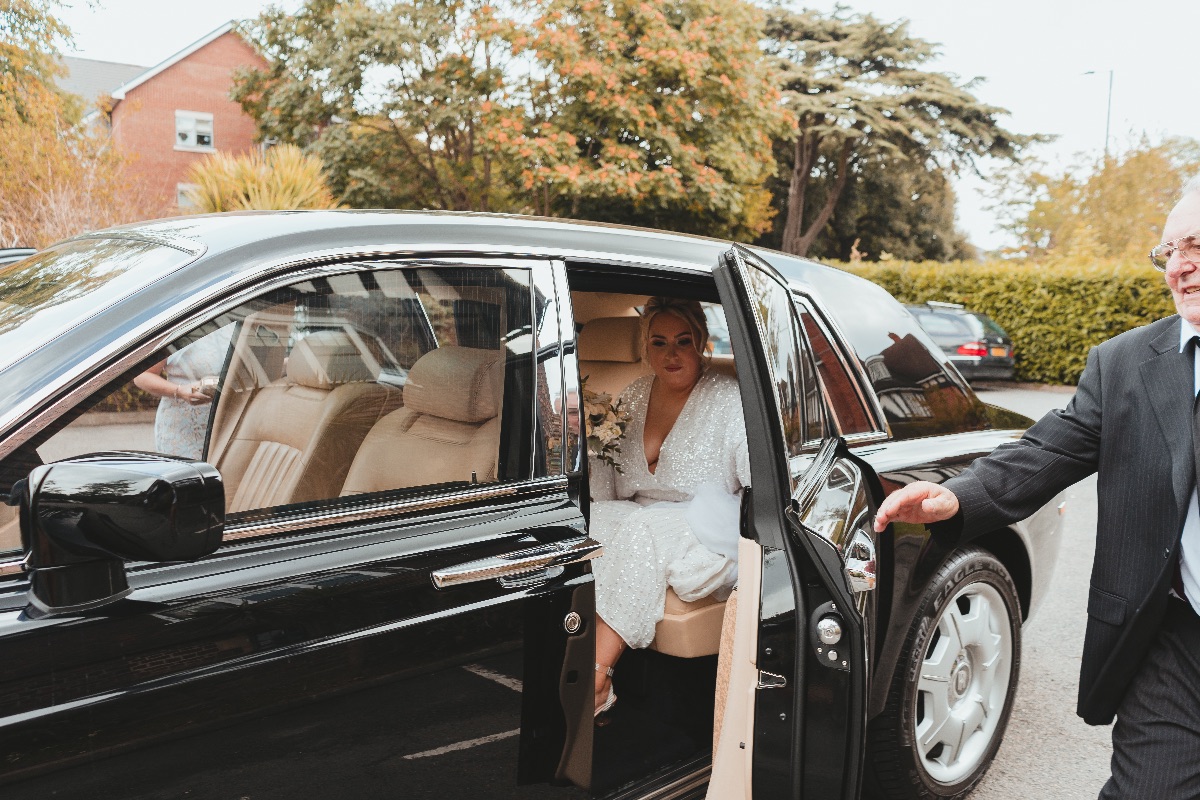 Bride arrives at Ceremony and prepares to exit the vehicle 