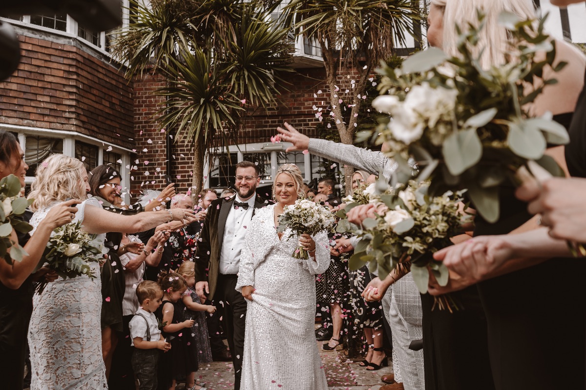 Bride and Groom leave Ceremony with confetti