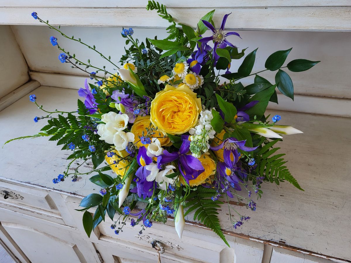 Country Garden Theme using beautiful garden yellow roses, Iris, Forget me nots and freesias